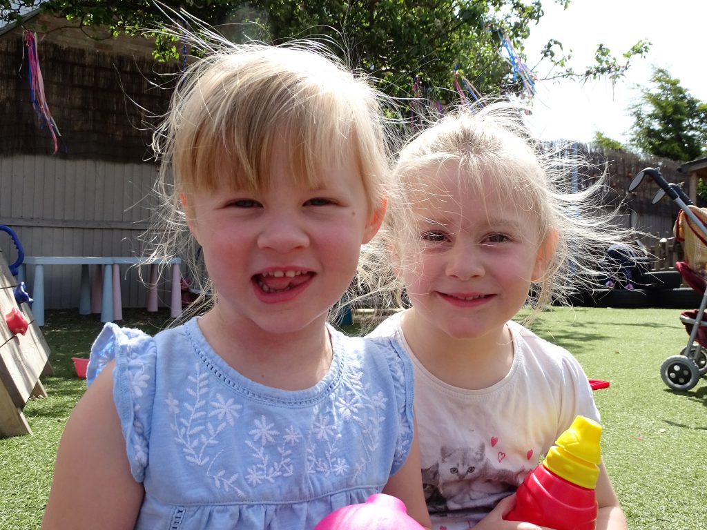 Children Smiling in Garden